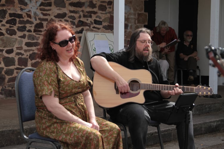 Brother and sister Chris Wemyss and Jenny McCalmont, from Roadwater, known as 'Wyrd Kin', entertain the folk festival crowd in Carhampton. PHOTO: George Ody.
