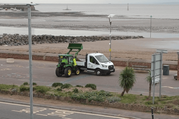 Sand accumulation being removed on a previous occasion from the Esplanade, in Minehead.
