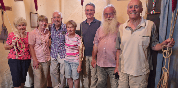 The Timberscombe church bellringing team with Reg Holcombe on his 90th birthday.