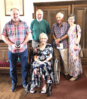 With Reg Holcombe for his birthday were his wife Mary (seated) with Andrew Holcombe (left), Archdeacon Emeritus Elwin Cockett, and Donna Shane.
