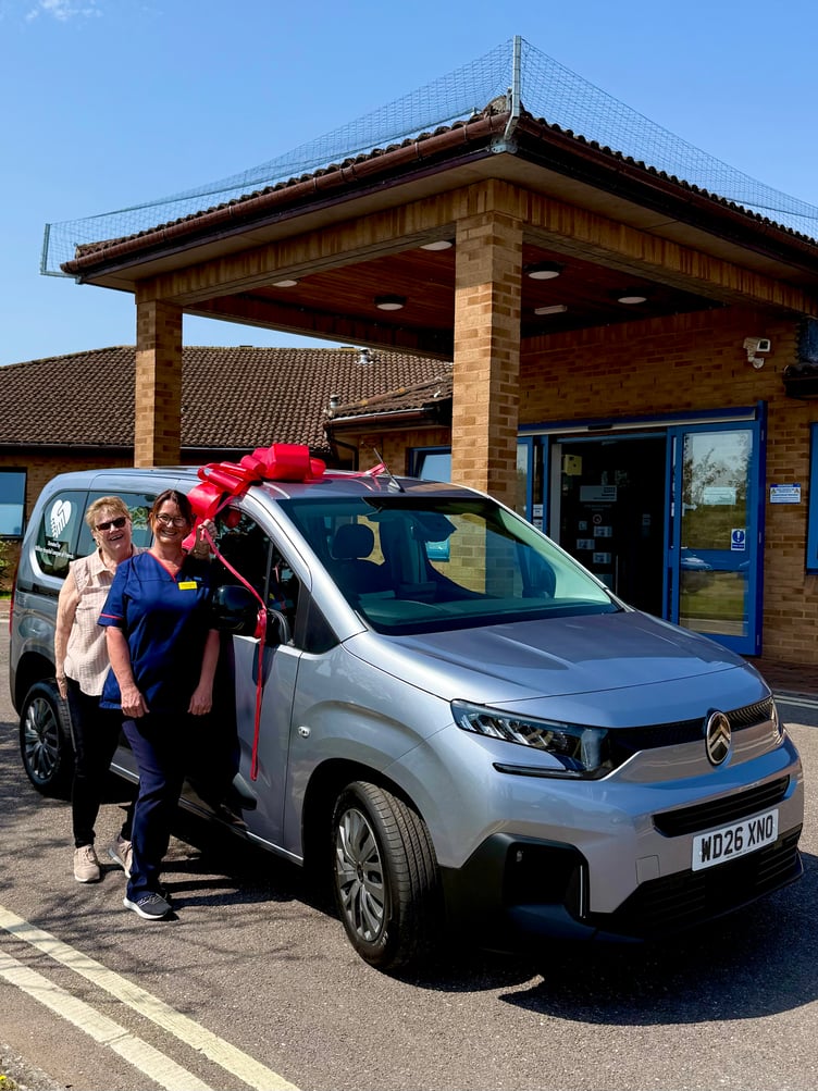 Sister Sharon Stone takes receipt of a new car for Williton Community Hospital from league of friends chairman Marilyn Hill.