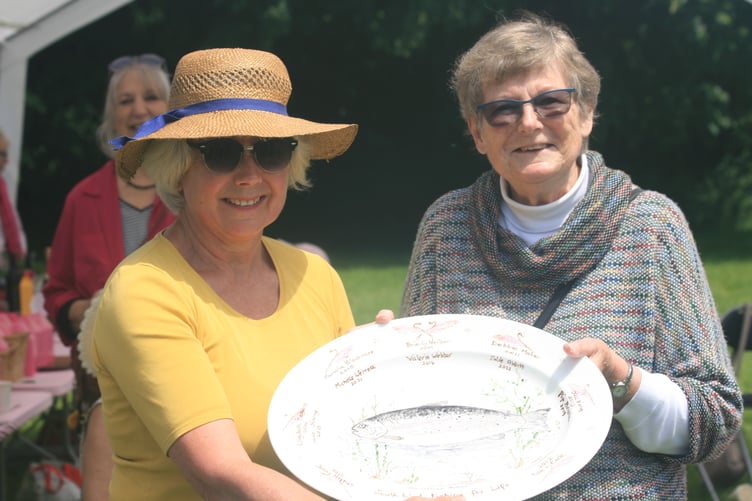 Jan Ross (right) presents South West Fishing for Life's Jane Gilbard with the Pauline Clements plate.