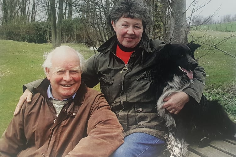 Tony Bigwood and partner Alison Hart with farm dog Benji.