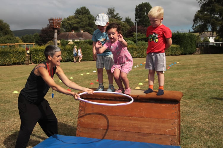 Zennor Hamai-Welford and friends Vinnie and Pharoah jumping through hoops at Williton Fete. PHOTO: George Ody.