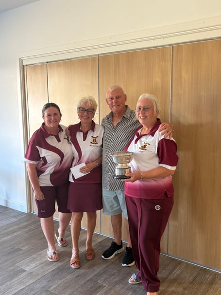 Mike Webber presents the triples trophy to the winners Little Mix: Gill Groves, Lisa Dart and Marguerite Nichols from Wellington