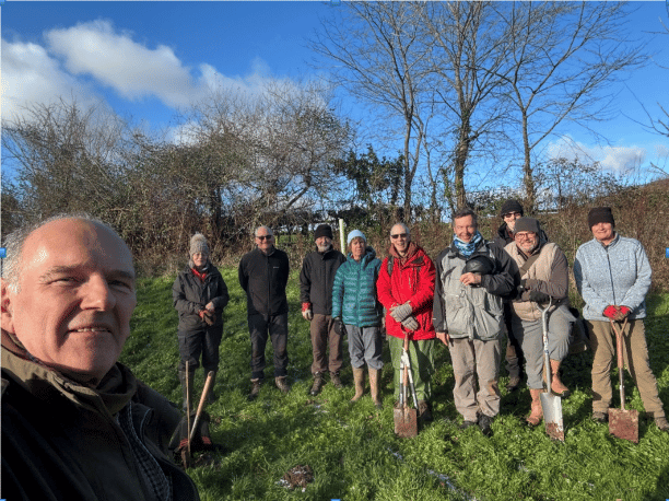 Friends of Quantocks chairman Robin Stamp planting elm trees with volunteers earlier in the year.