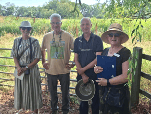 Town seeks gold again as bloom judges visit