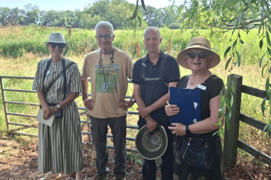 Minehead Mayor Cllr Craig Palmer escorts South West in Bloom judges during their judging visit this week.