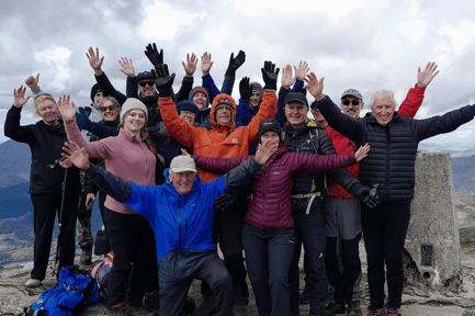 Graham Boswell, kneeling, at the top of Ben Lomond - the final Munro he climbed.