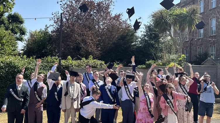 Aurora Foxes college students celebrate their graduation in Minehead.