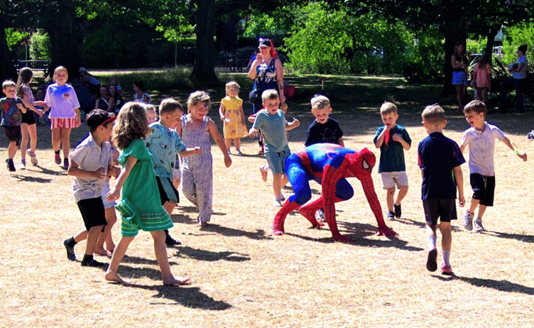 It's a brand new day in Blenheim Gardens, Minehead, as 'Spider-Man' entertains children as schools break up for summer.