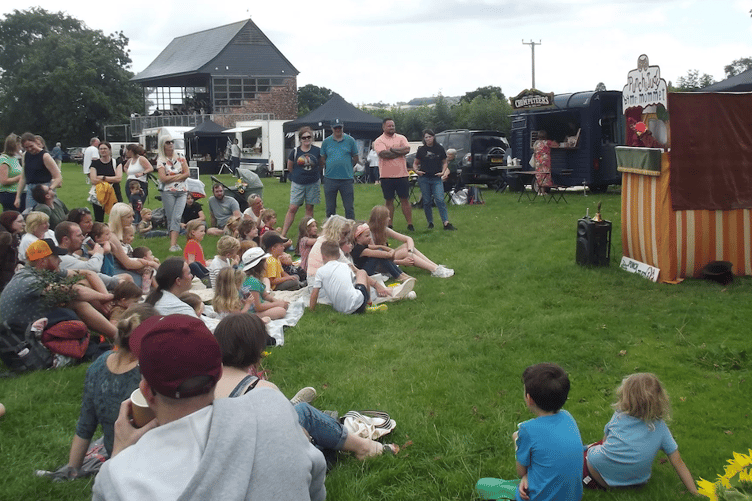 A Punch and Judy show entertains visitors to an earlier Wivey Show on Wiveliscombe Recreation Ground.