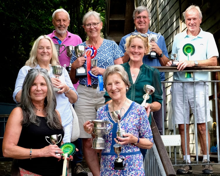 Wootton Courtenay Flower and Produce Show cup winners (left to right) Sarah Fox, Ruth Walker, Rob Reed, Roz Griffin, Veronica Clegg, Kate Carter, Ian Stephens, and Terry Walker. PHOTO: Peter Clapham.