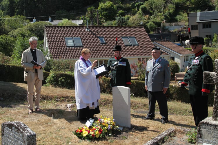The Rector of Porlock, the Rev Ann Gibbs, leads a graveside rededication service in Hawkcombe Cemetery for a German airman killed in World War Two PHOTO: George Ody.