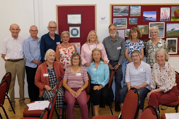 Sustainable Wootton Courtenay Committee with MP Rachel Gilmour (rear, left) are back row - Peter Clapham, Peter Hoyland, Andrew Dutton, chairman Ruth Walker, James Macbeth, Kate McKenzie, and Barbara O’Keefe; Front - Daphne Wilbraham, Pip Pointer, Beate Fankhänel, Jane Barbieri, Valerie Clapham.