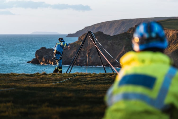 Coastguards involved in a cliff rescue operation.