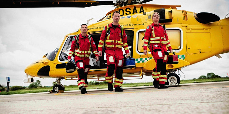 A Dorset and Somerset Air Ambulance crew walking from their helicopter.