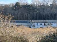 Residents to march on empty factory site