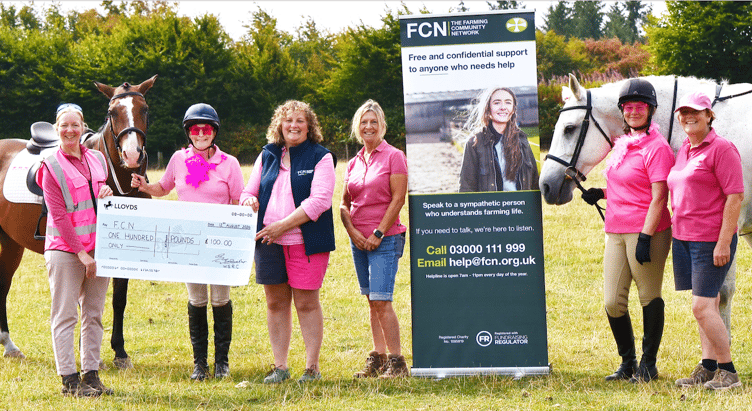 Members of West Somerset Riding Club presented a cheque to Farming Community Network representative Charmain Dascombe after a pink dressage charity event. PHOTO: Liz and Leonie Photography.
