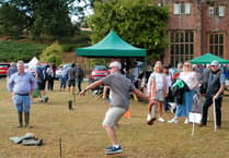 Welly throwing particularly appropriate at rain-hit Nettlecombe Fete