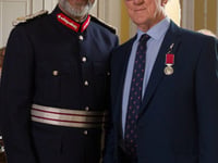 Coach crash hero receives his Empire Medal