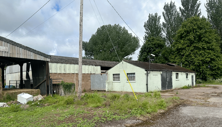 Dunster Estate wants to convert the single-story building in this photograph to a farm shop. PHOTO: Architectural Studio South West.