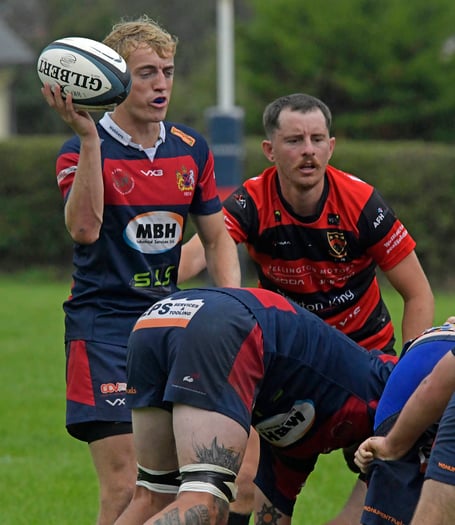 Wiveliscombe's Richard Baker, ball in hand, is set for a scrum.
