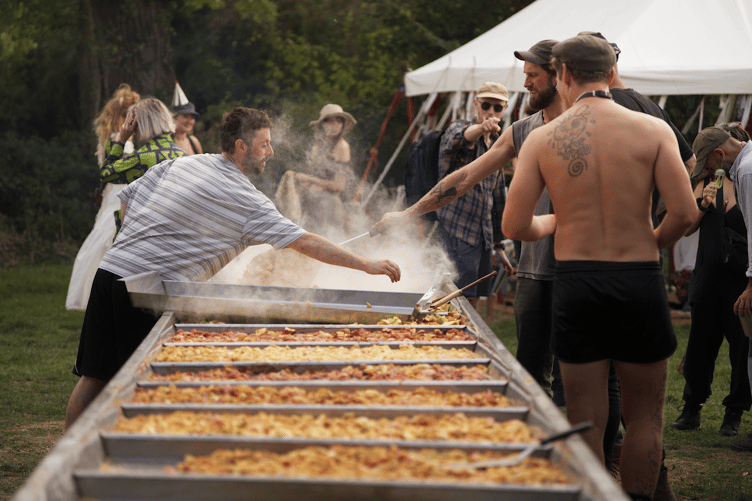 A huge apple crumble being baked for a communal feast at the Ferally Good Folk Festival.