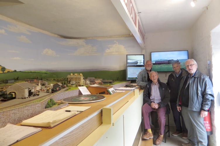 Pictured with a working model of Dulverton Railway Station are (standing left to right) John Atkins, who took the train to attend Huish School, Taunton, model railway project lead Chris Nelder, and current volunteer Gerry Lewis, with (seated) Keith Ross, who was also a student in Huish School.
