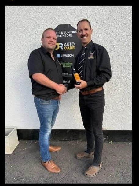 Second XV team manager Justin Harris (left) presents the MOTM award to Jason Richard.