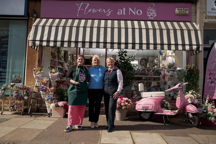 Minehead florist Kate Daven-Thomas (centre) celebrates a huge National Lottery win with work colleagues.