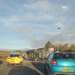 Lorry and tractor overturn in roundabout crash 