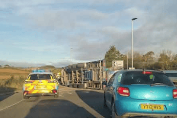 A vehicle can be seen overturned in this photograph of Monday's crash on the A39 roundabout outside Tropiquaria Zoo.