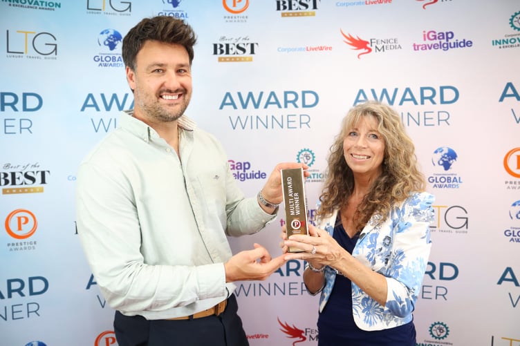 Minehead holistic practitioner Venetia Moore collects one of two awards he business has won this year.