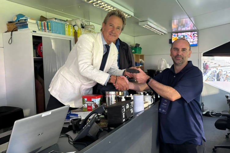 Mark Nicholas, left, chairman of MCC, presents Kevin Mitchell with his commemorative medal.