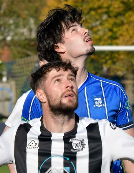Former Taunton Town player Lewis Smith (in blue) who now plays for Minehead