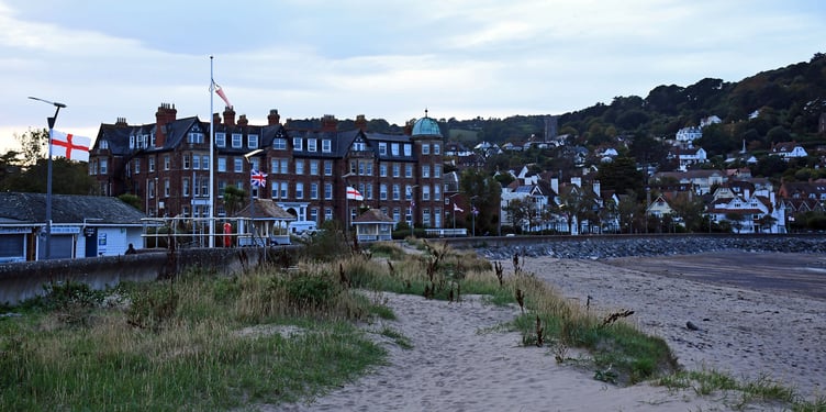 Flags flying from lampposts on Minehead sea front after a visit by 'Flagman'.