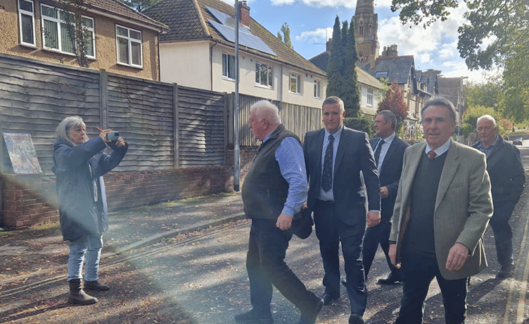 Quantock Staghounds huntsmen Christopher Gibbons and Martin Watts (third and fourth left) are filmed by an anti-hunt campaigner as they leave court in Taunton. PHOTO: Mario Laghos.
