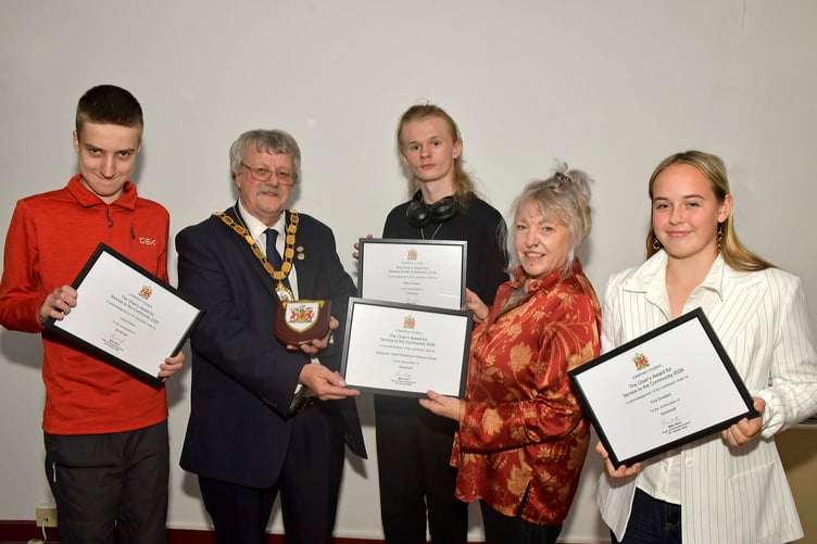 Lucas Cross, Blake Sheard, and Eva Dowden receive awards for their work on the Somerset Youth Parliament, along with a special certificate for their advisory group.