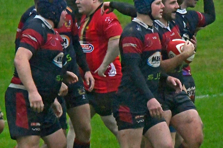 Tom Stone (ball in hand) who scored two tries for Wiveliscombe